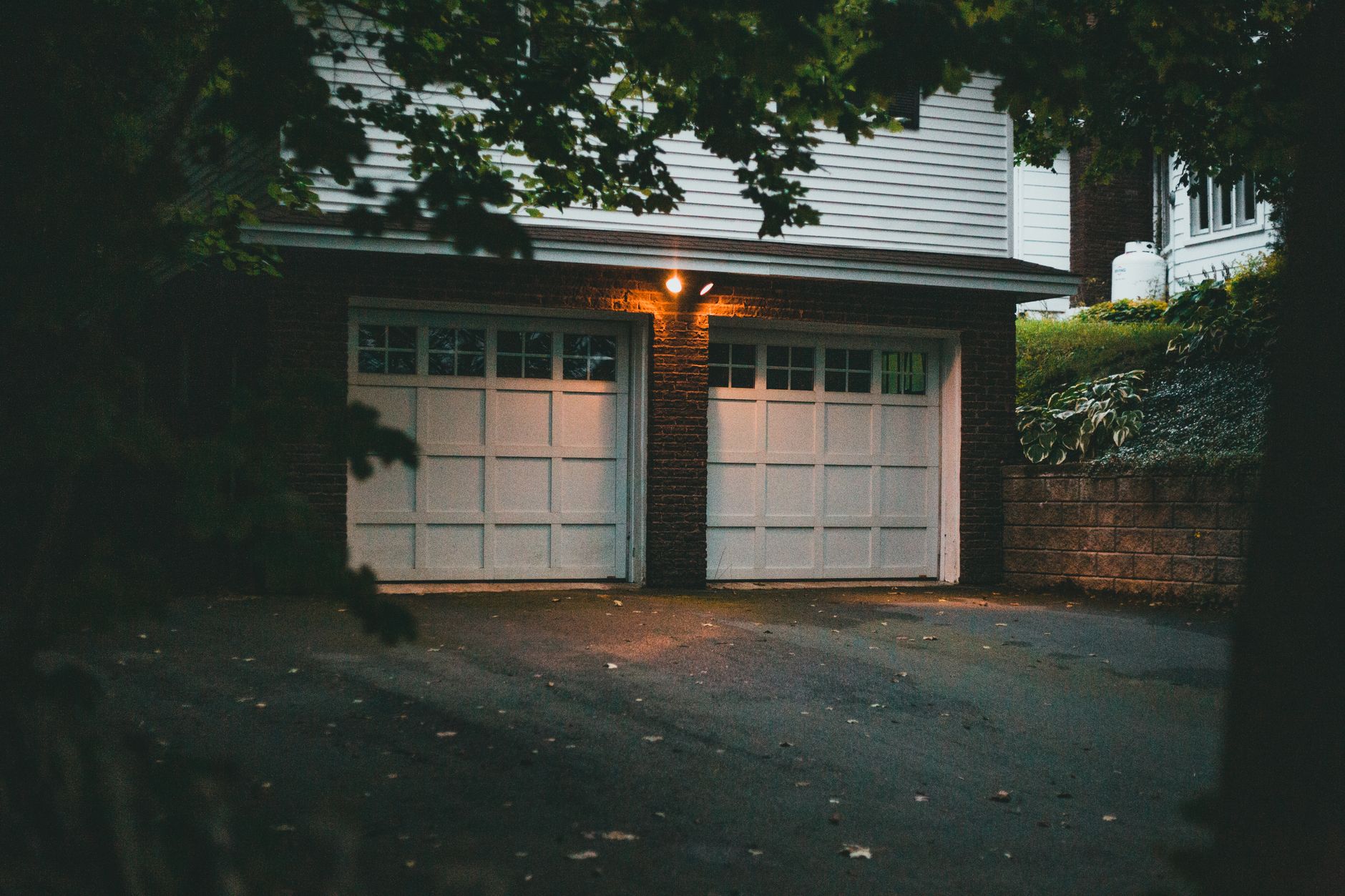 Garage door sensor with amber blinking light indicating problem