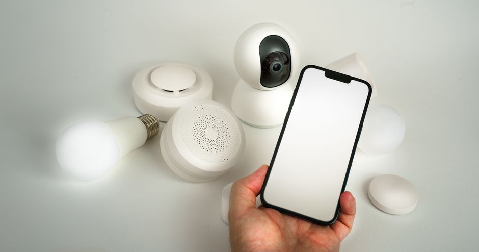 Smart home devices controlled via smartphone, showing MyQ garage door app integration