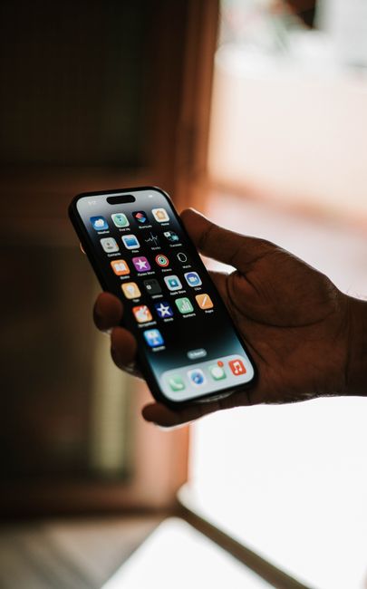 Hand holding smartphone with garage door opener app