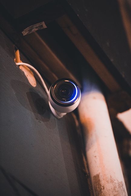 Best Garage Door Opener With Camera (2026 Picks) 4 Security camera mounted on indoor wall for garage door opener monitoring