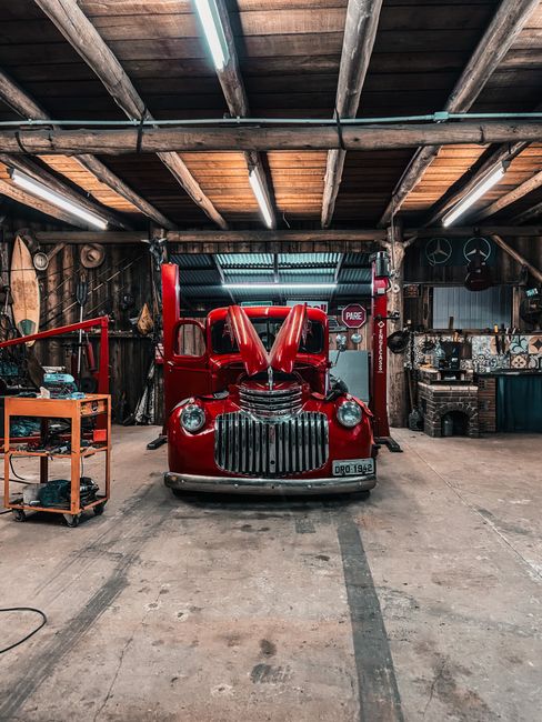 Genie Model 450 Garage Door Opener: Fix or Replace? 4 Vintage car parked in a rustic garage workshop