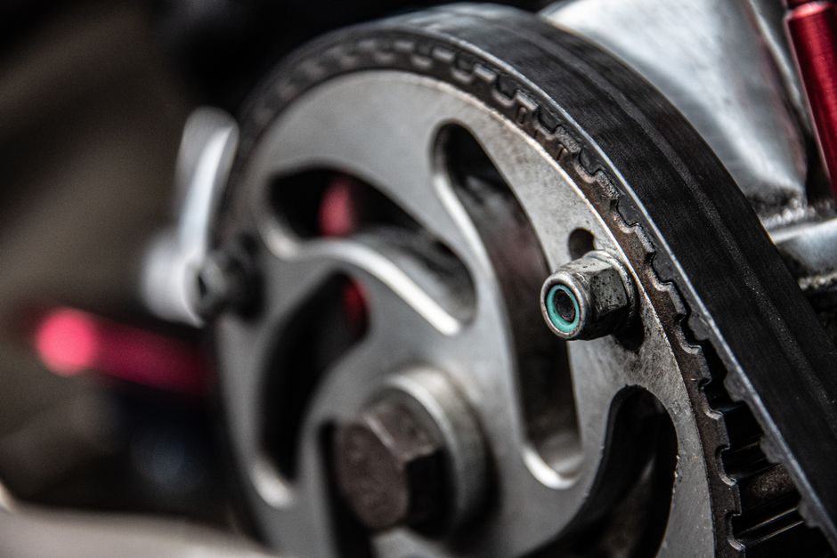 Best Genie Garage Door Opener in 2026 (By Type and Budget) 2 Close-up of rubber timing belt on sprocket, similar to a garage door belt drive system