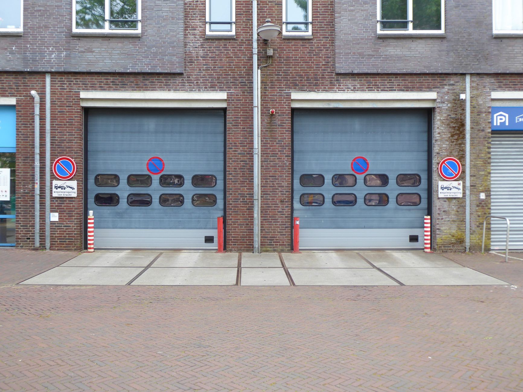 Garage door safety sensor photoelectric eye on track