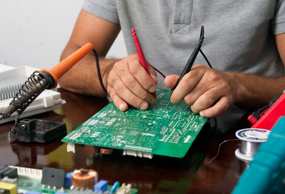 LiftMaster 1/3 HP Troubleshooting: Fix Every Problem Fast 4 Close-up of repaired electronic circuit board for LiftMaster opener