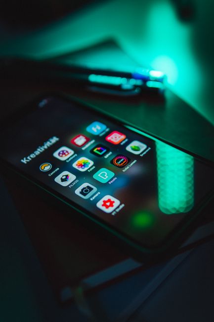 Smartphone with app icons representing MyQ troubleshooting