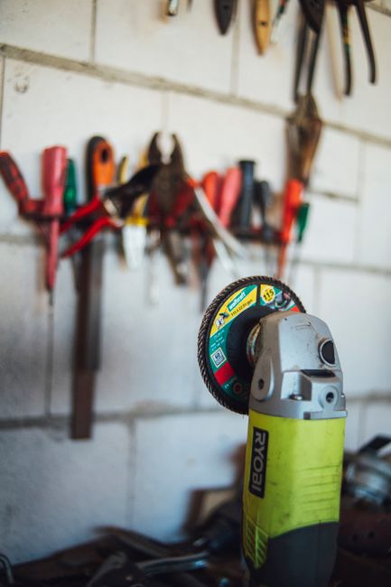 Is the Ryobi Garage Door Opener Compatible with Alexa? 4 Power tools on workshop wall representing garage door opener wiring setup
