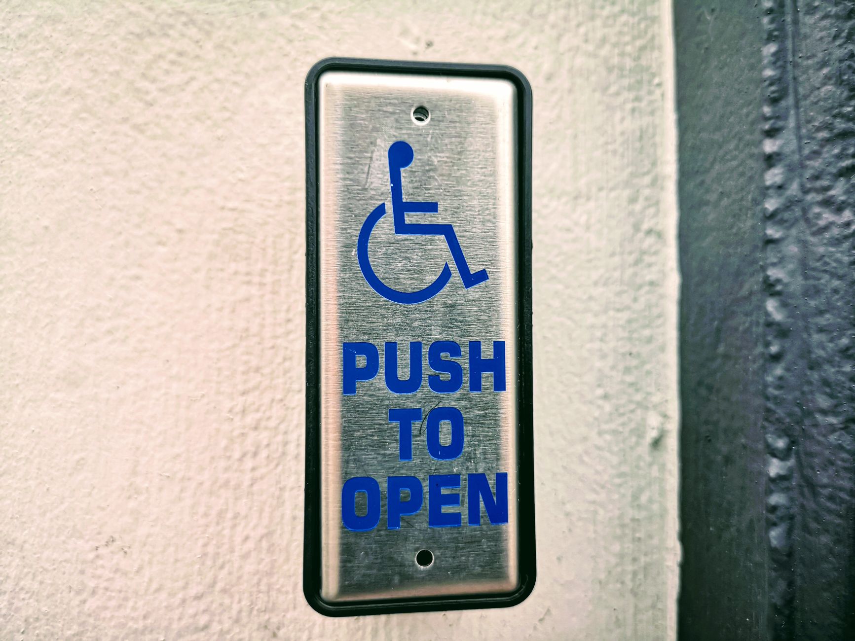 Garage door opener learn button for reprogramming remote