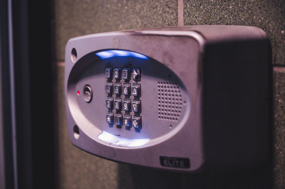 Illuminated security keypad on wall for smart garage door opener access control
