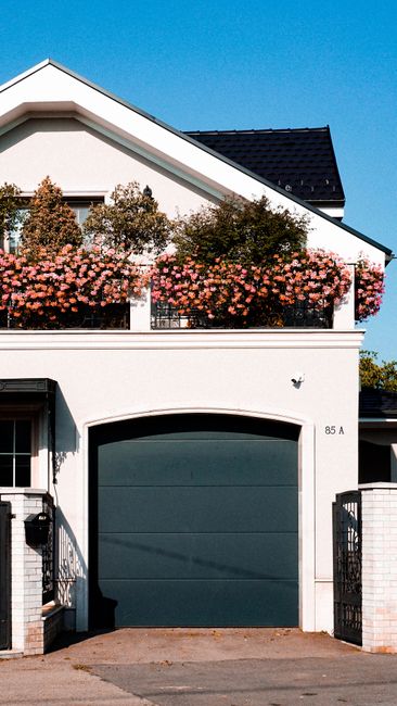 Best Garage Door Opener for 8 Foot Door (2026 Guide) 3 Stylish urban house with garage door suitable for 8 foot opener installation