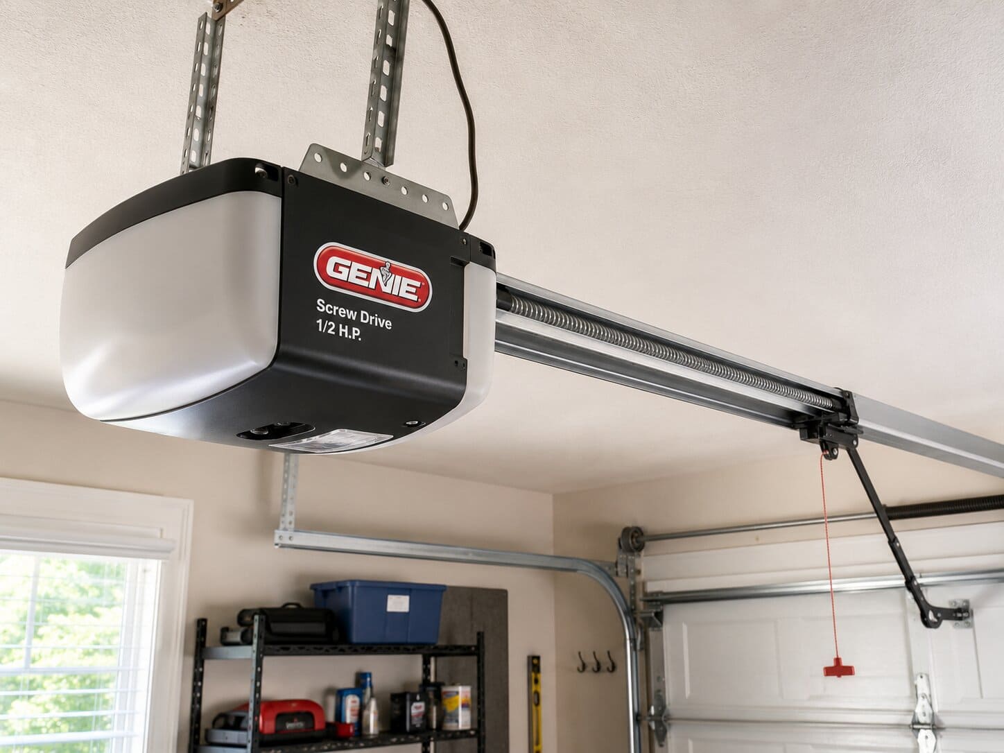 Genie garage door opener motor unit with battery backup mounted on ceiling