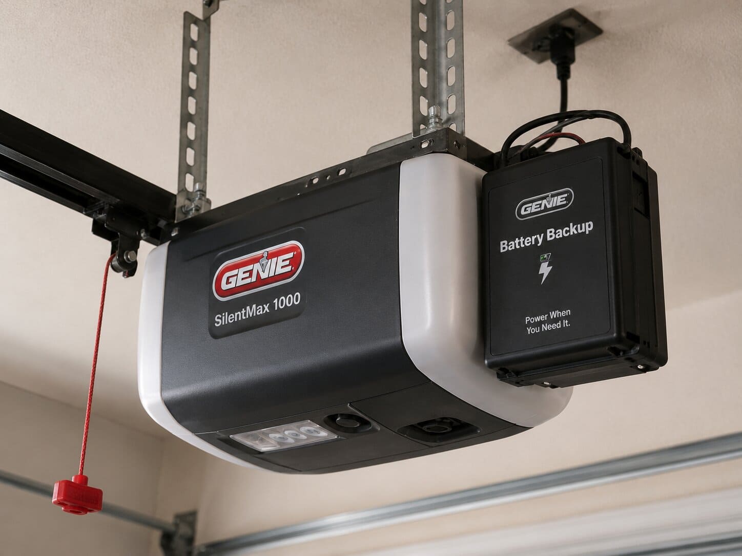Genie screw drive garage door opener motor unit mounted on garage ceiling