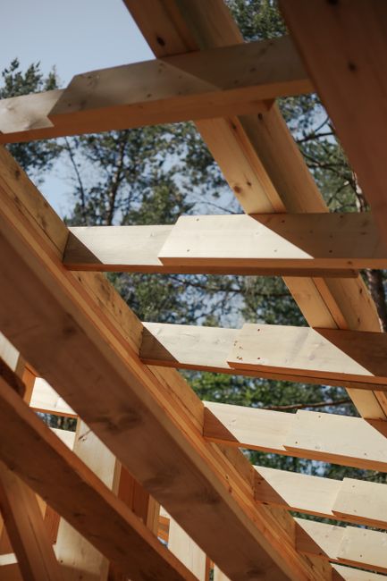 Close-up view of wooden structural beams used in header framing