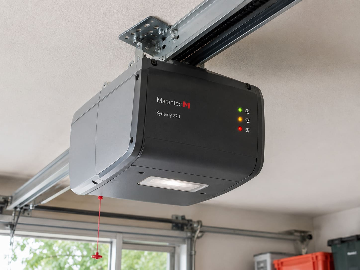 Marantec M-4700 garage door opener motor unit mounted on ceiling showing LED indicator lights
