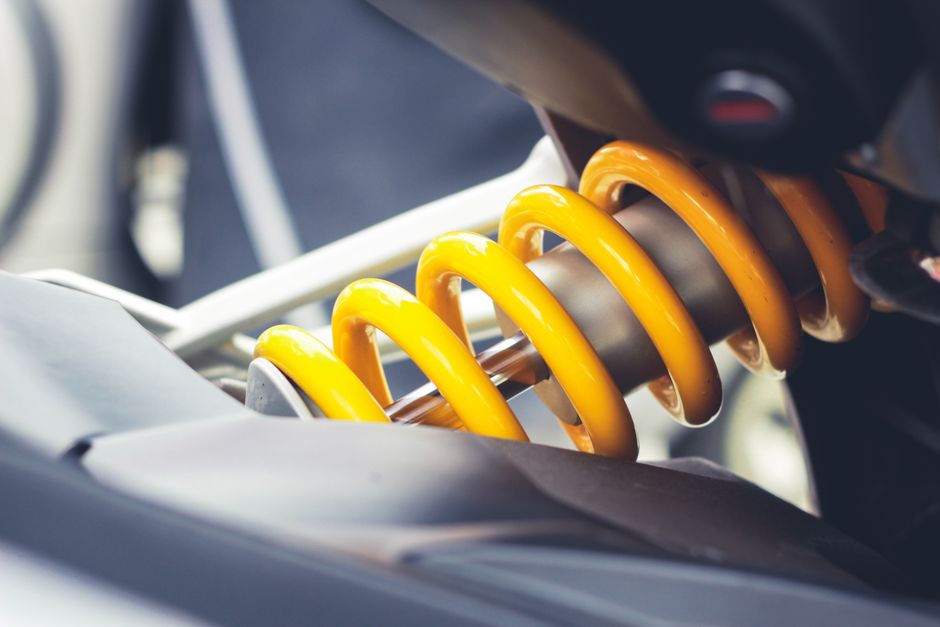 Best Garage Door Torsion Springs (2026 Picks by Cycle Life) 3 Close-up of a coil spring showing mechanical engineering detail for measuring wire size