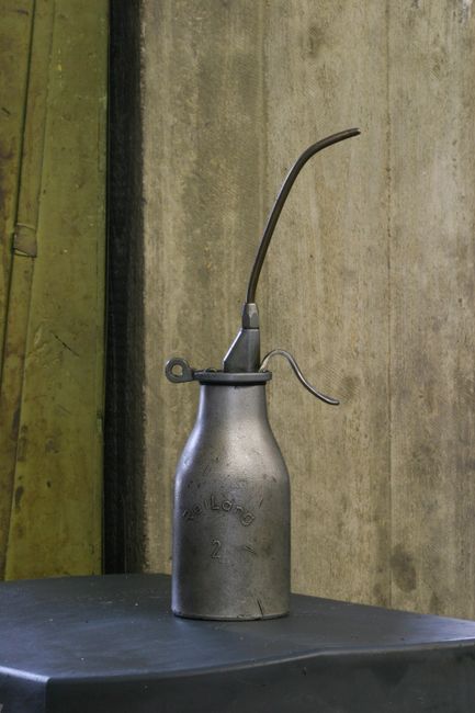 Best Lubricant for Garage Door Springs (2026 Picks) 3 Classic metal oil can representing lubricant options for garage door springs