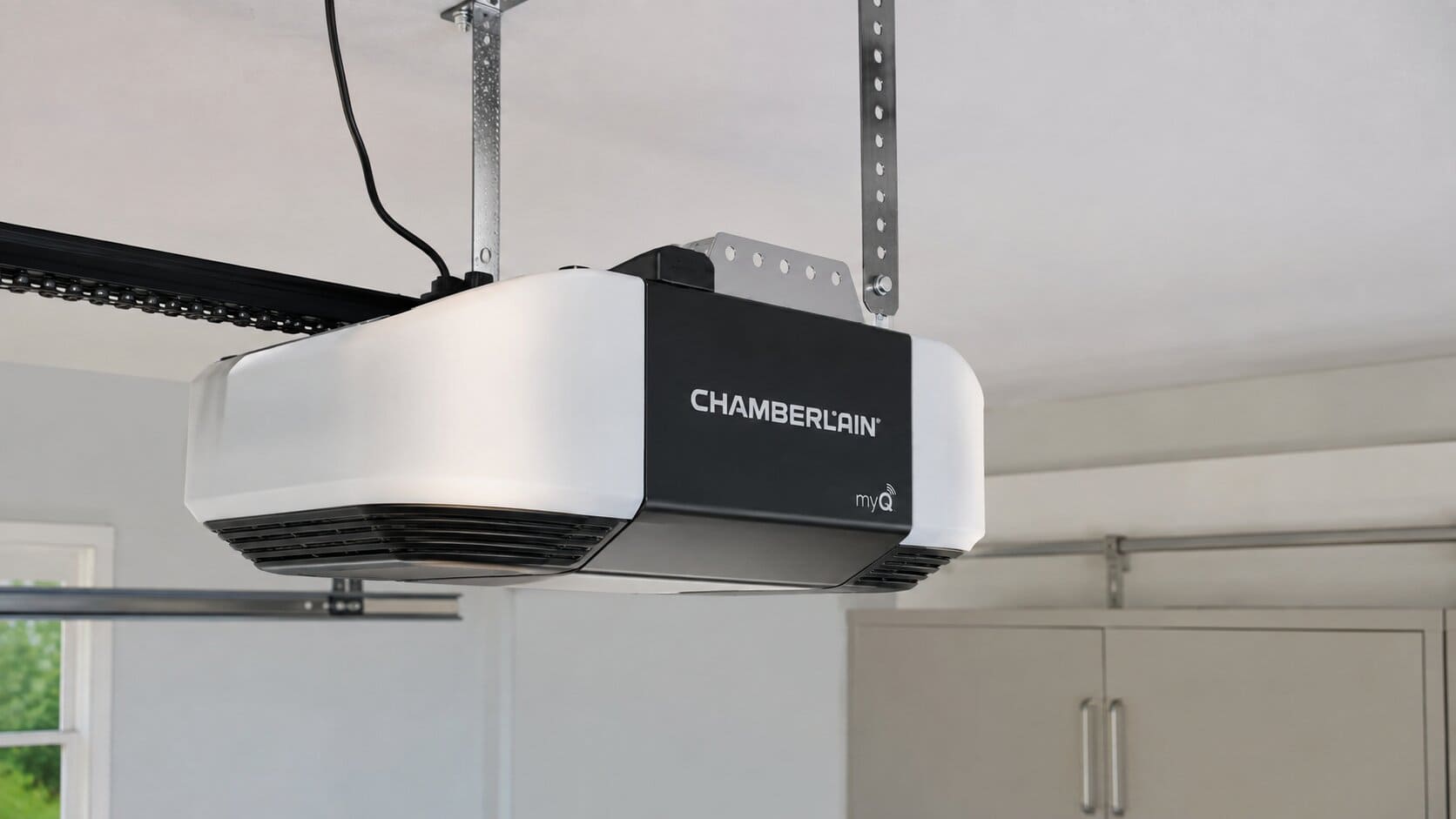 Best Chamberlain Garage Door Opener in 2026 (By Model) 5 Close-up of Chamberlain garage door opener with built-in camera lens facing driveway
